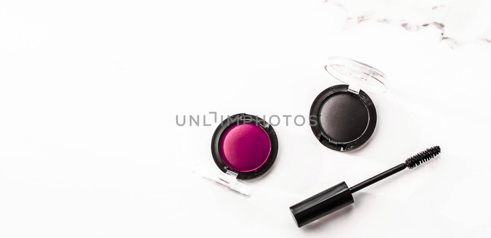 Cosmetic branding, blog and girly concept - Eyeshadows, black liner and mascara on marble background, eye shadows cosmetics as glamour make-up products for luxury beauty brand, holiday flatlay design