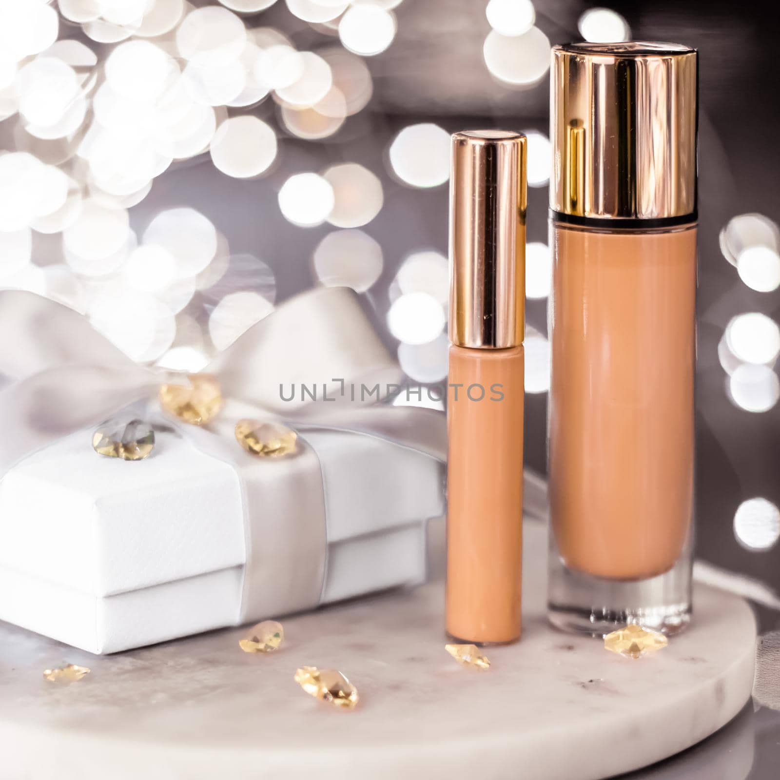 Cosmetic branding, Christmas glitter and girly blog concept - Holiday make-up foundation base, concealer and white gift box, luxury cosmetics present and blank label products for beauty brand design