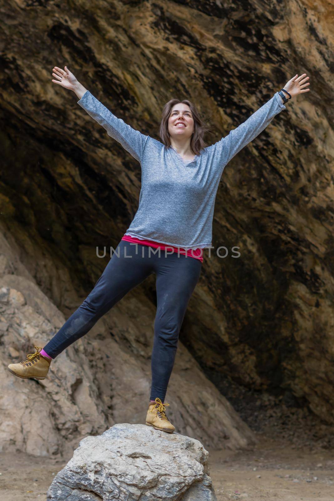 young woman rock climbing by joseantona