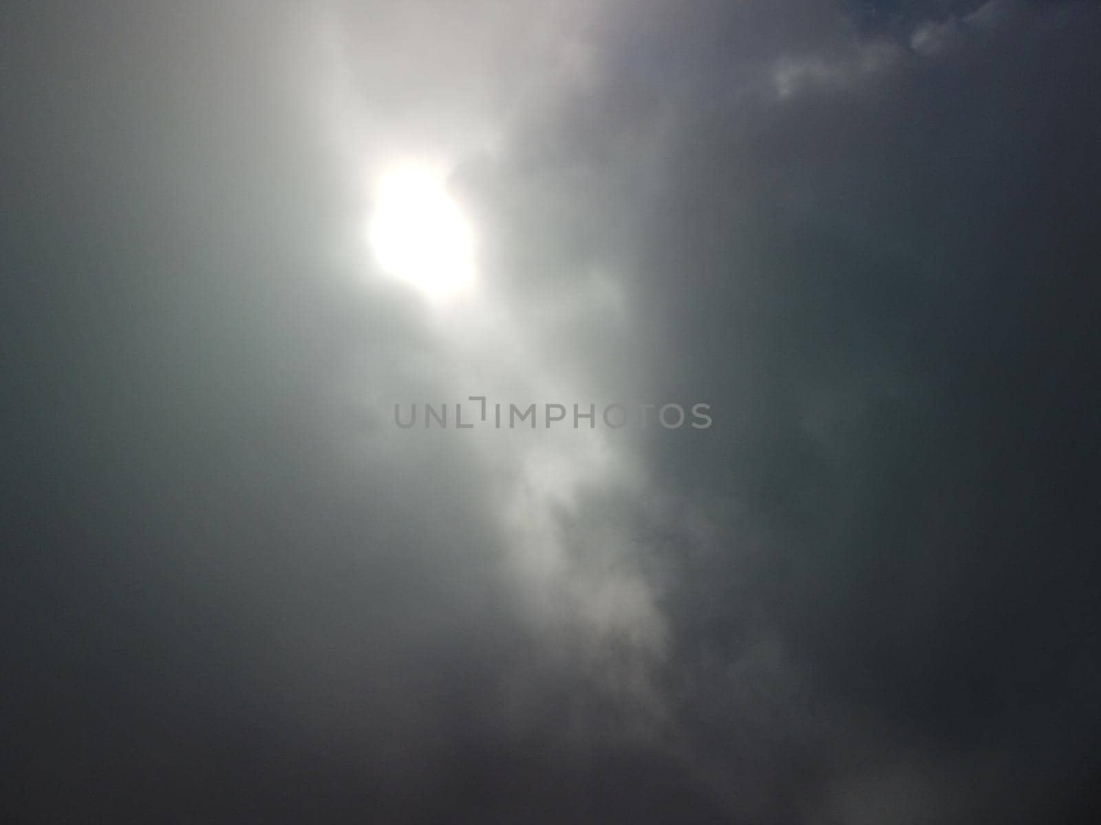 Aerial view drone flying above white clouds dense fog move quickly. Drone flies high back in blue sky through fluffy clouds. Beautiful foggy and cloudy slow moving Aerial view. Fog sea.