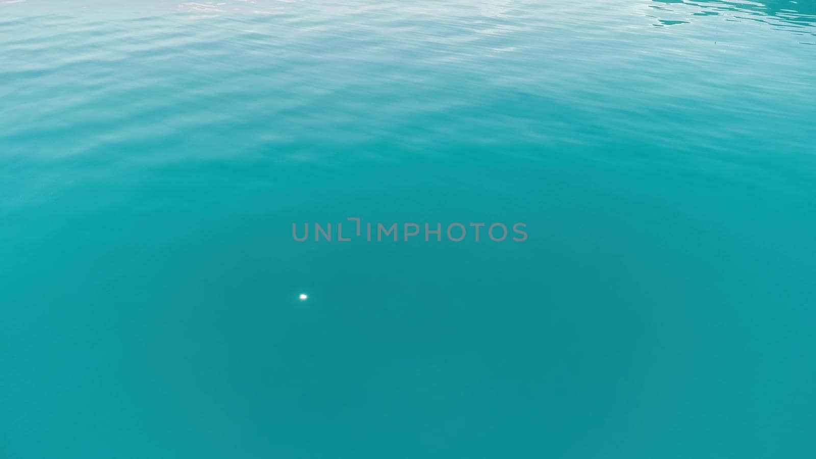 Aerial panoramic view of seascape with crystal clear azure sea and rocky shores. Yachts in a beautiful lagoon on backdrop of rocks. The concept of an ideal destination for summer travel and vacation. by panophotograph