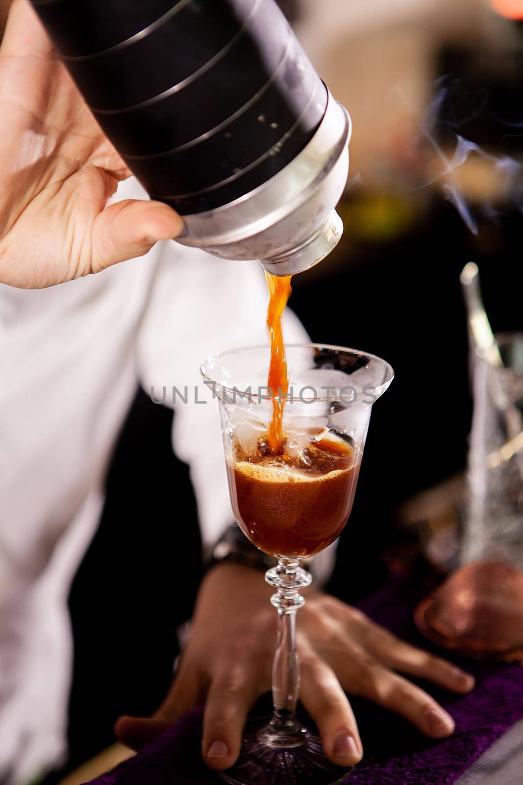 Barman making alcohol coffe drink.Pouring drink