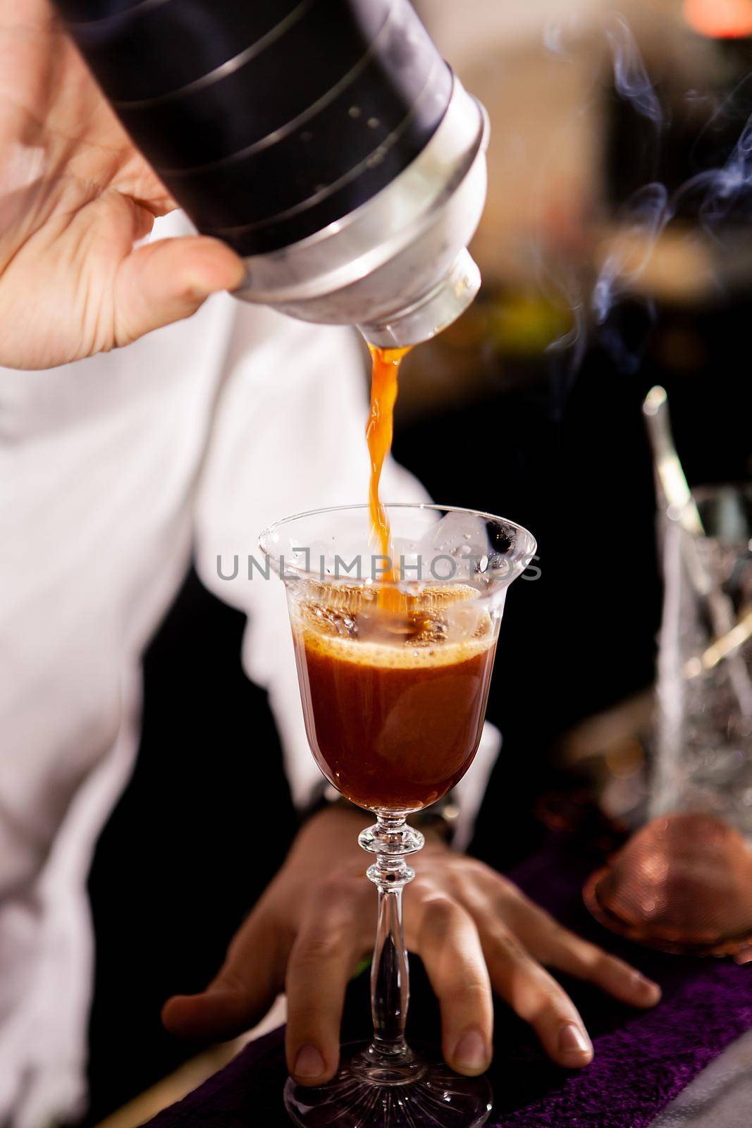 Barman making alcohol coffe drink.Pouring drink