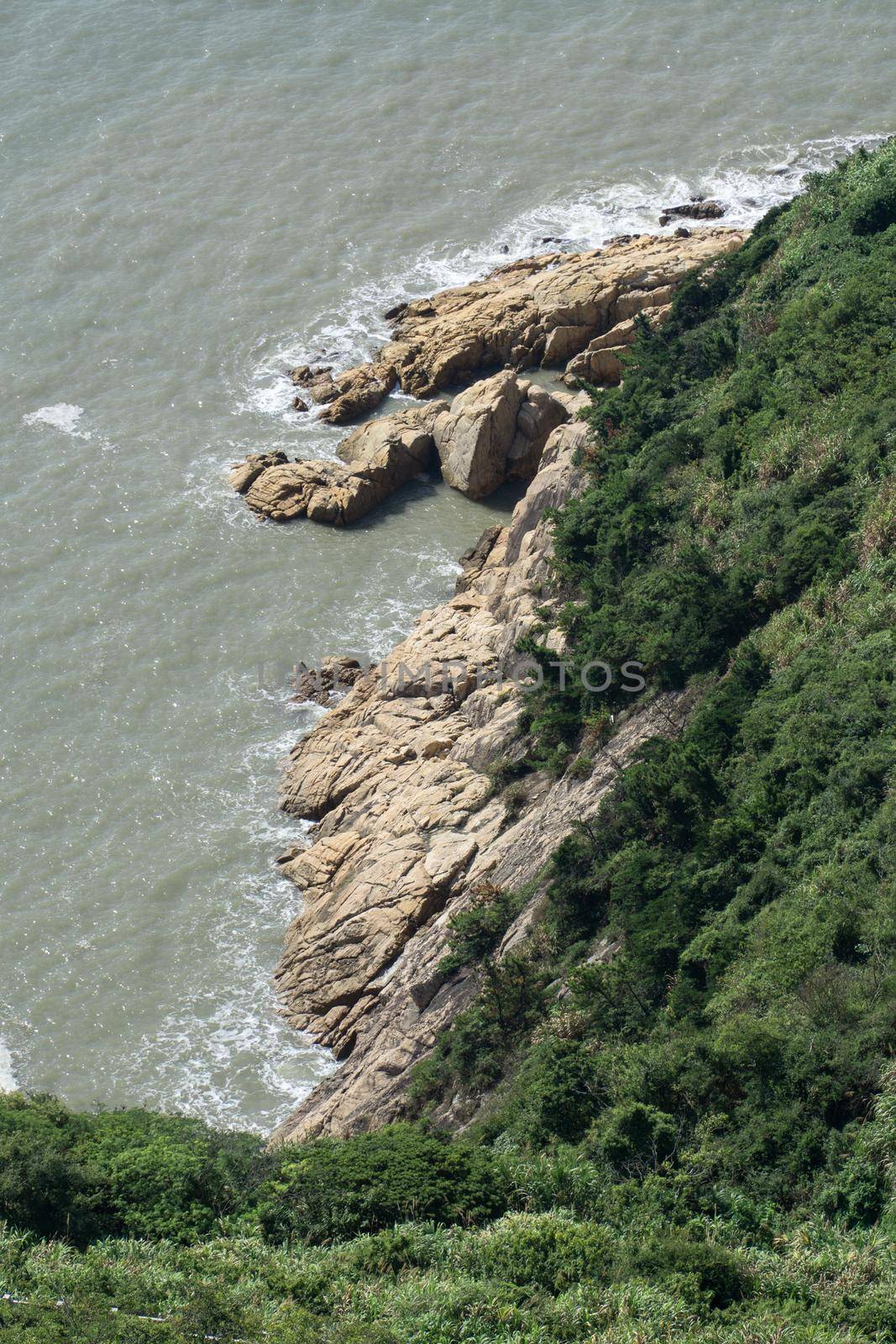 Spindrift and rocks by the sea, photo in Taizhou, Zhejiang, China.