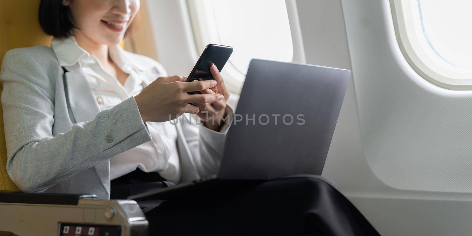 Fund investment woman confirm meeting to client before flight take off. working and travel concept by itchaznong