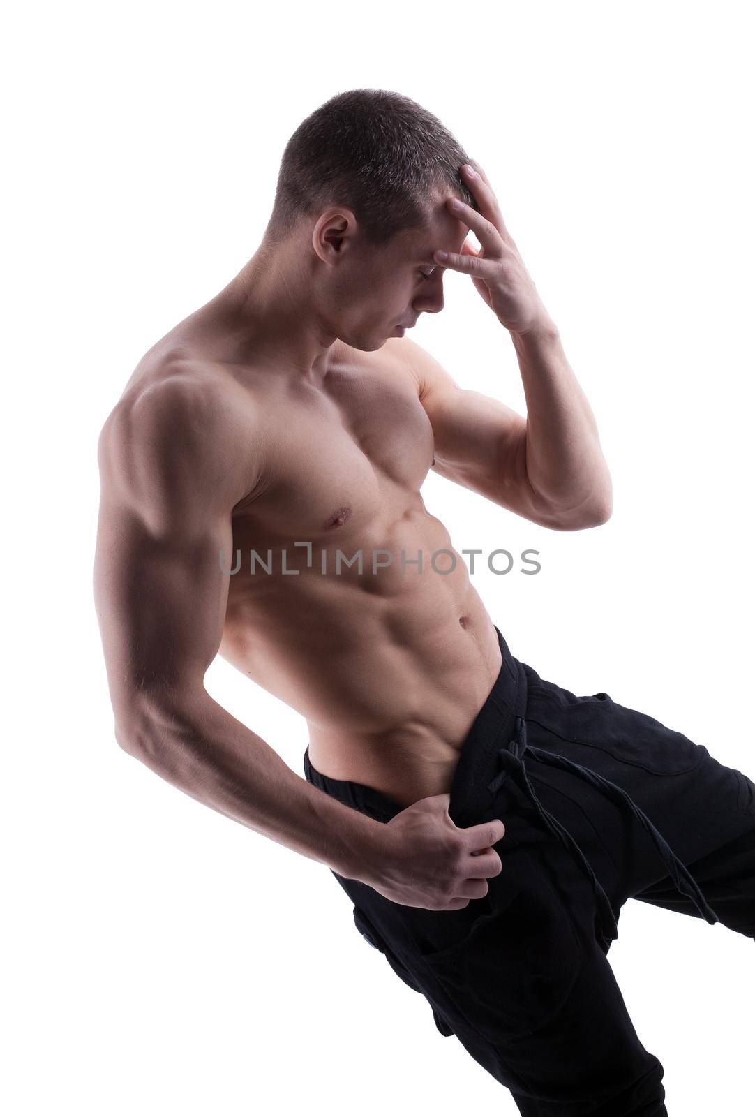 sexy young strong man posing nude isolated
