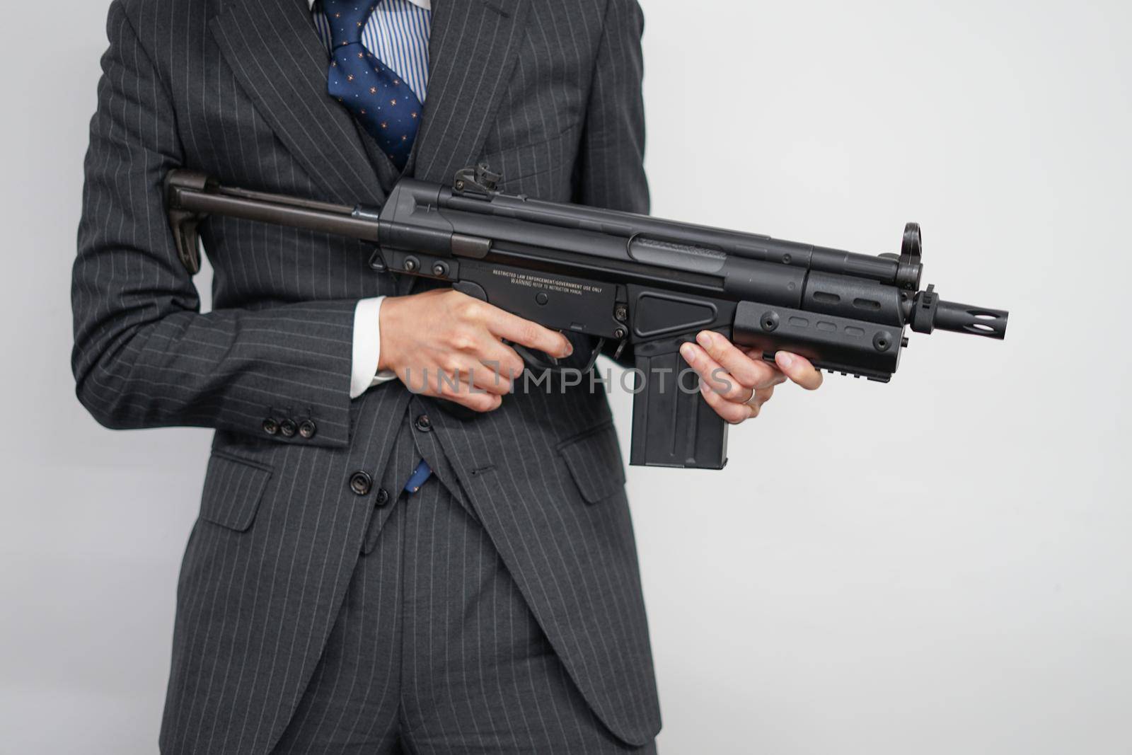 Fight businessman with machine gun. Shooting Location: Tokyo metropolitan area