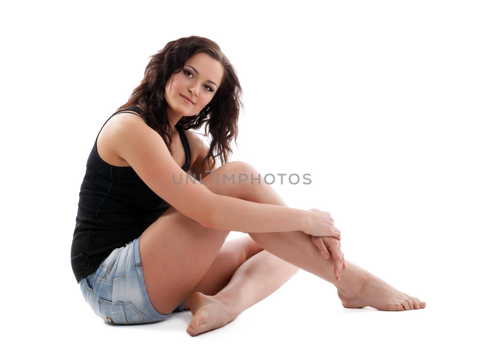 Yong girl sit on white - casual dress and curly hair isolated