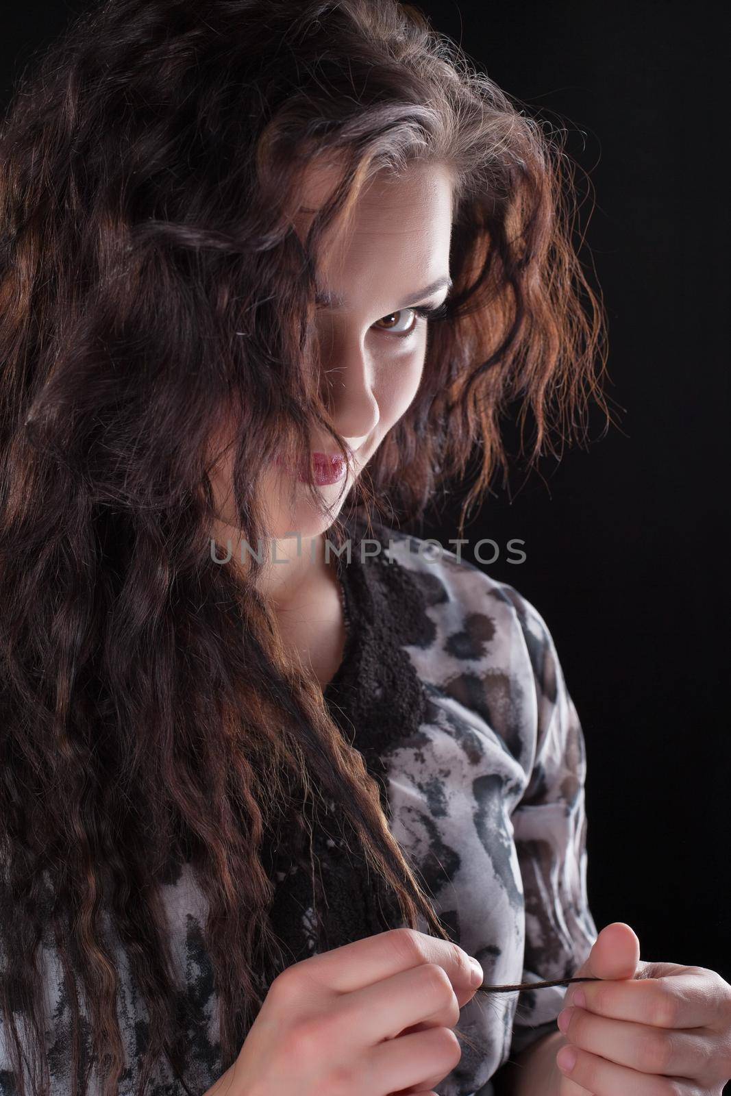 Curly brunette woman look at camera - wait for dating