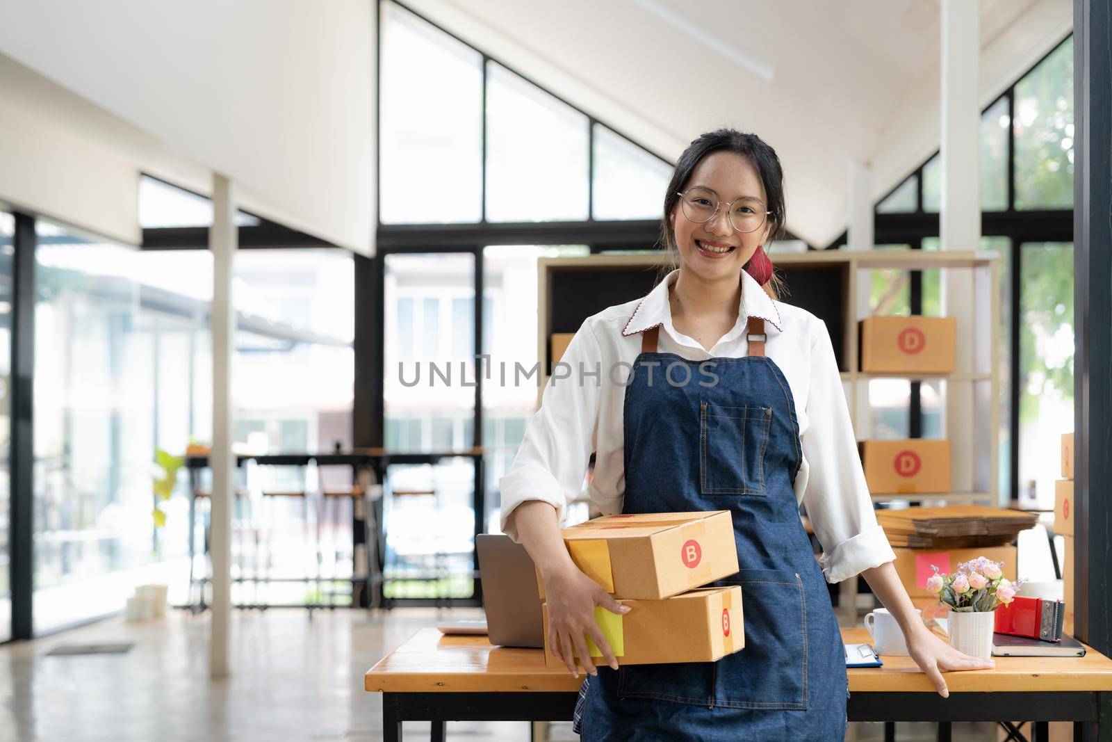 Startup small business entrepreneur SME freelance woman working with box, Young asian online market packing box delivery, SME delivery e-commerce telemarketing seller concept. by nateemee