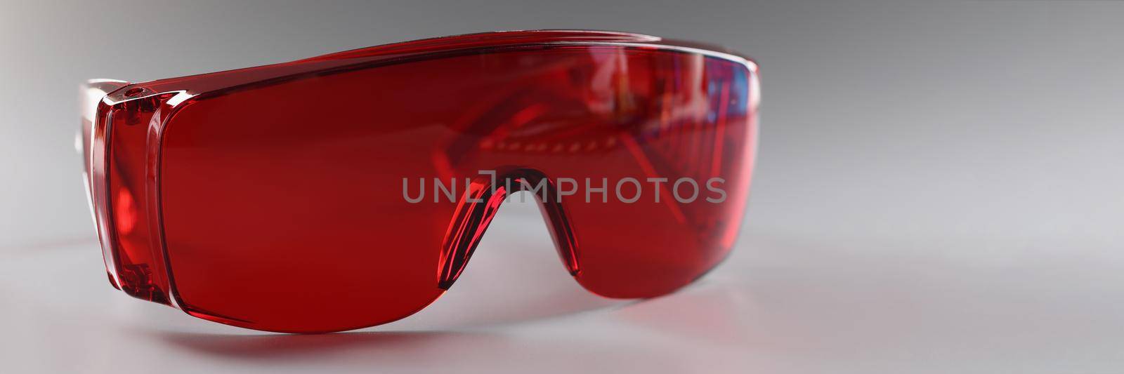 Red plastic safety glasses, protective workwear for human eyes by kuprevich