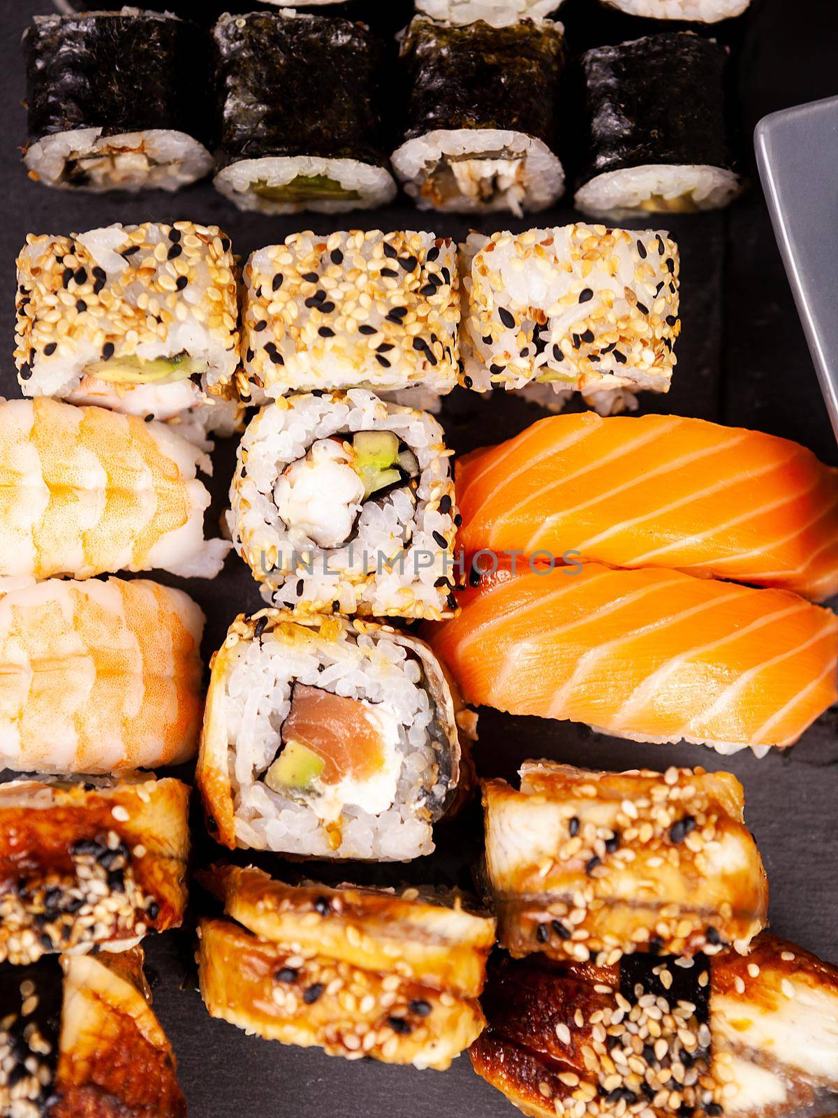 Top view close up of sushi rolls in variety by DCStudio