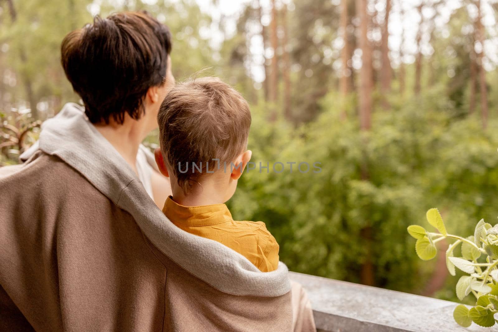 Happy grandmother and grandson enjoy time together. Positive middle age woman spending time with little, cute grandchild, having fun. 50-year-old grandma with grandkid. Multi-generational family