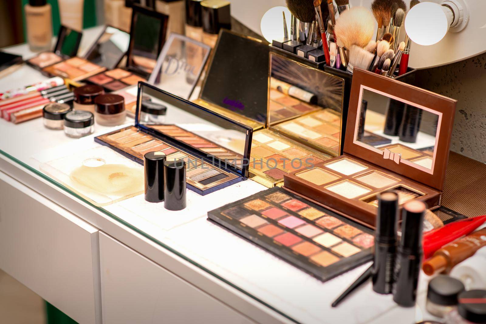 Set of decorative cosmetics on the table in a beauty salon. by okskukuruza