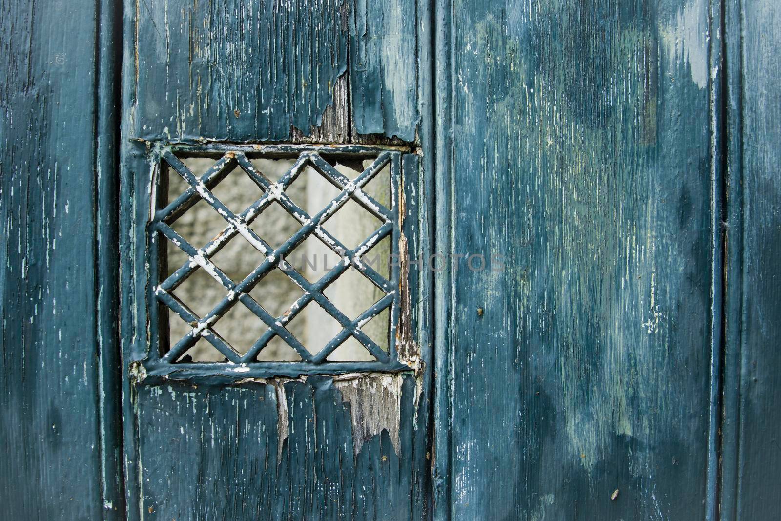 Emerald shabby door Cracked weathered wooden board texture