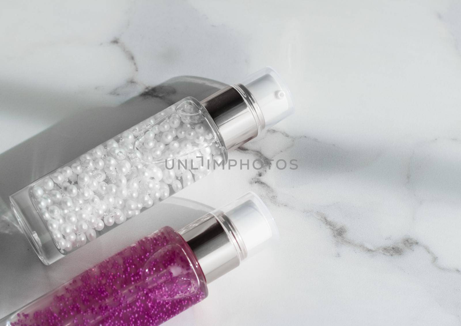 Cosmetic branding, packaging and make-up concept - Skin care serum and gel bottle, moisturizing lotion and lifting cream emulsion on marble, anti-age cosmetics for luxury beauty skincare brand design