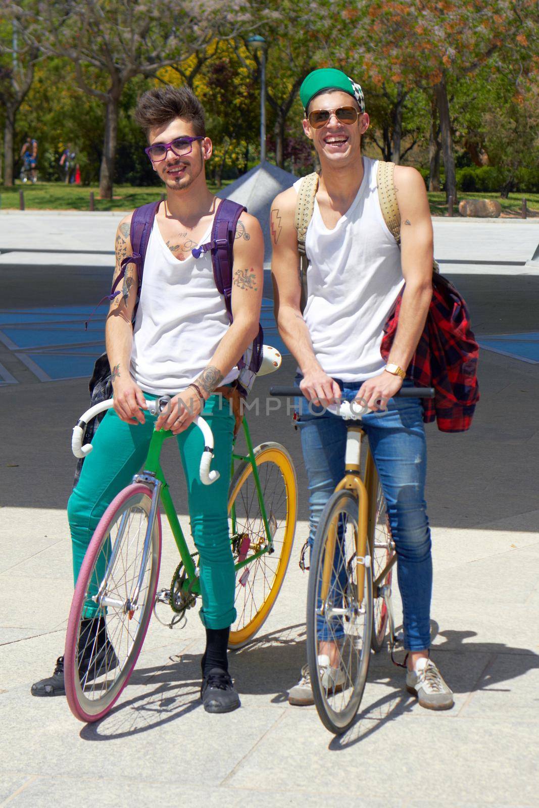 Chillin after a good ride. Full length shot of two young guys sitting on their bikes outdoors