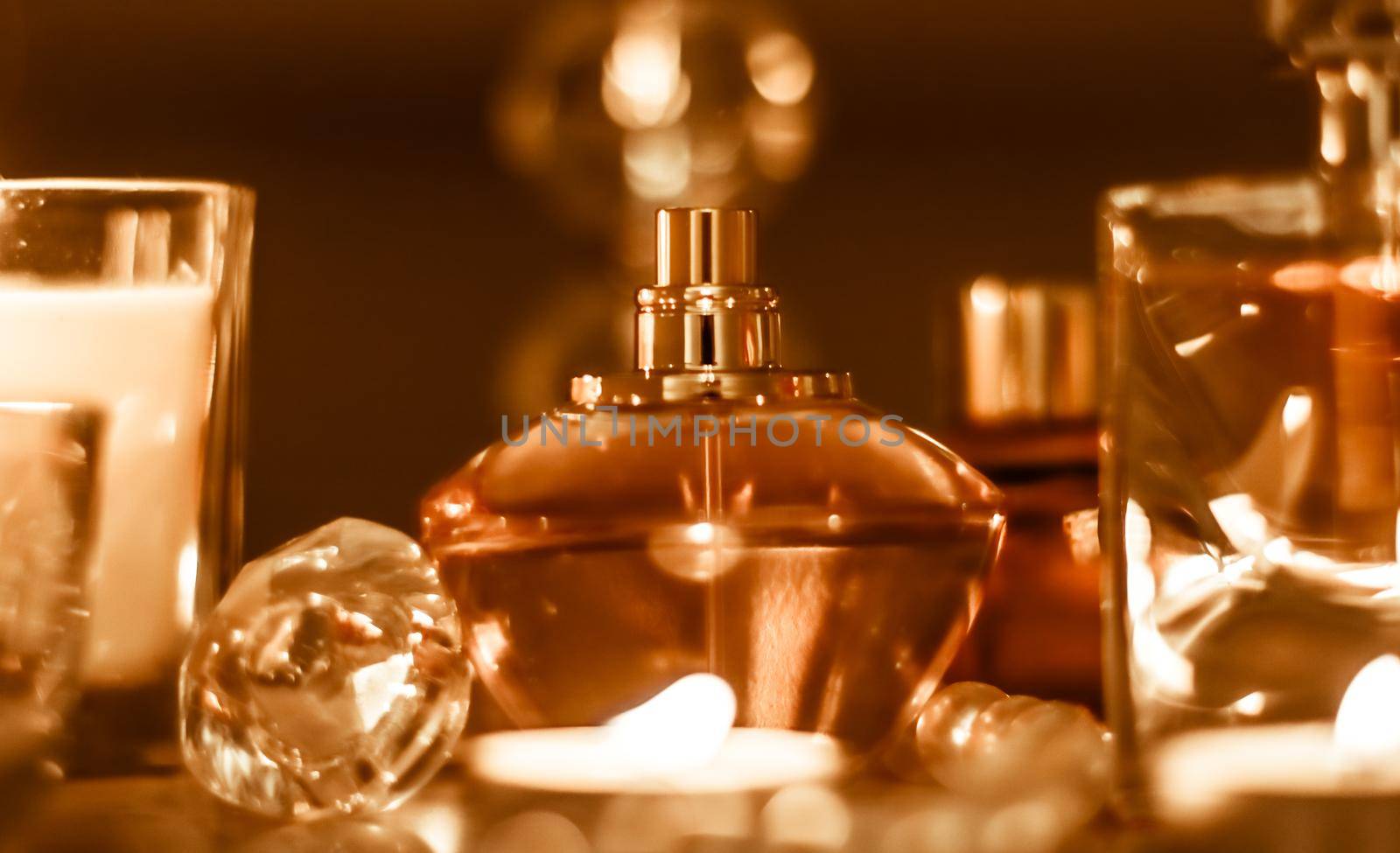 Perfumery, cosmetics branding and luxe concept - Perfume bottle and vintage fragrance on glamour vanity table at night, pearls jewellery and eau de parfum as holiday gift, luxury beauty brand present