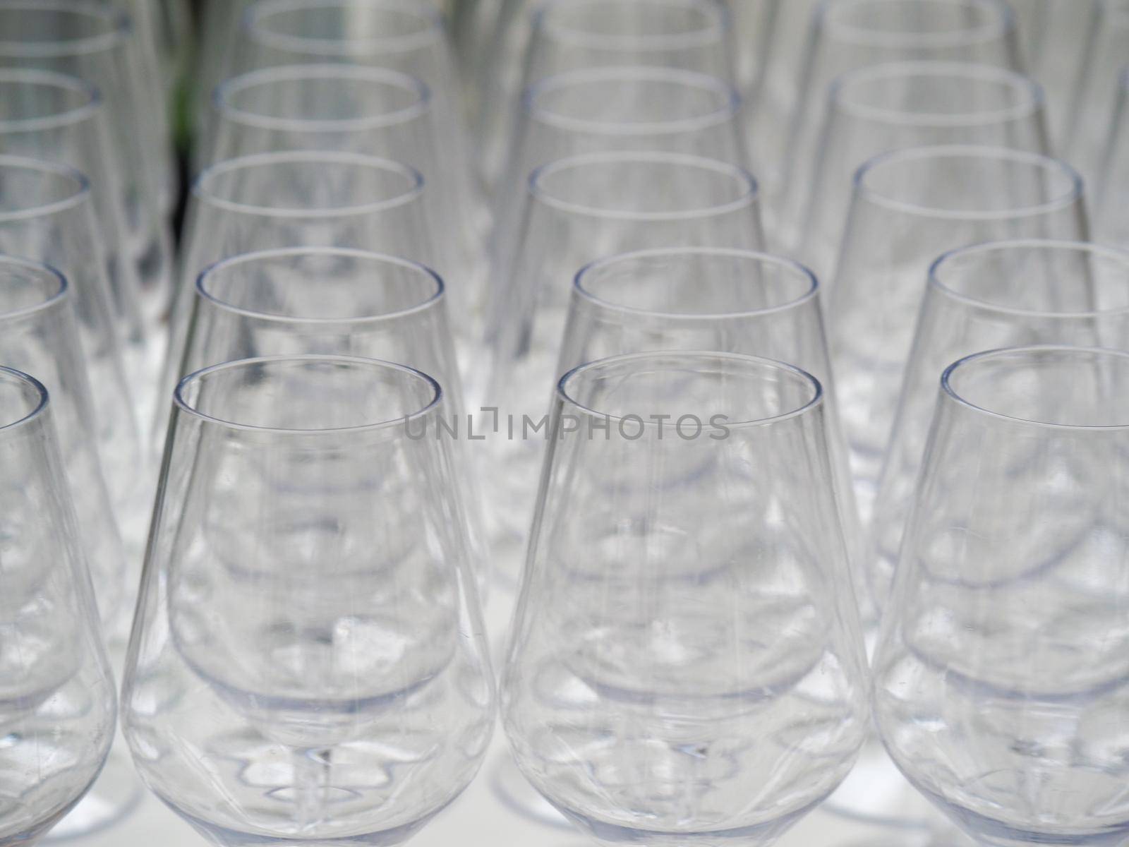 a group of wine glasses in event preparation - catering concept by verbano