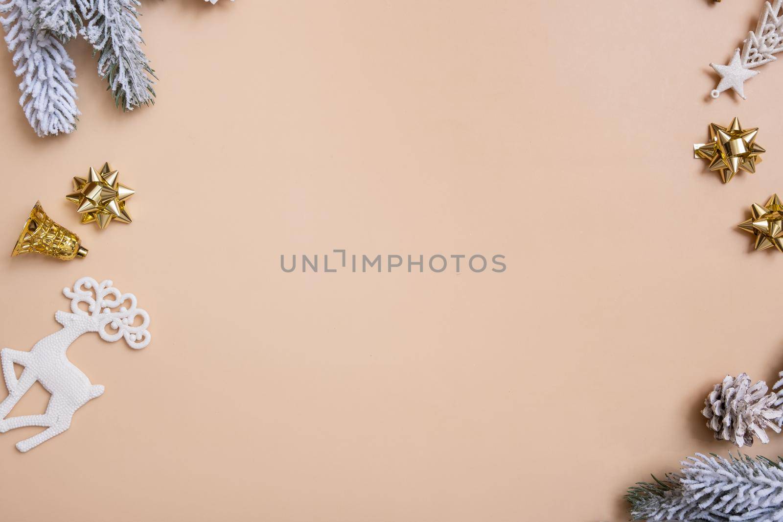 Christmas flat lay composition with bows, cones, pine on colored background top view. Copy space. High quality photo