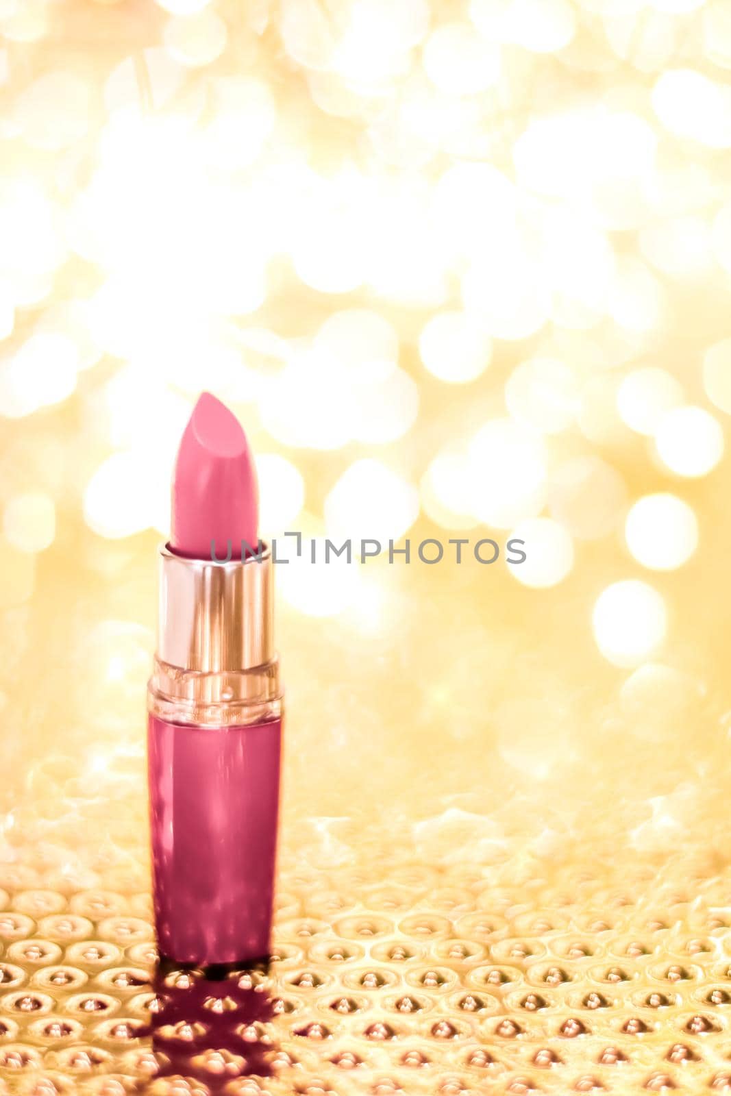 Cosmetic branding, sale and glamour concept - Rose lipstick on golden Christmas, New Years and Valentines Day holiday glitter background, make-up and cosmetics product for luxury beauty brand