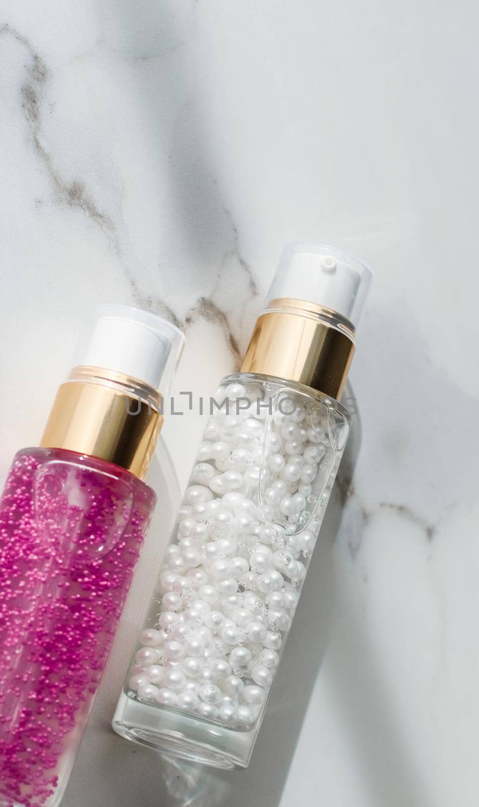 Cosmetic branding, packaging and make-up concept - Skin care serum and gel bottle, moisturizing lotion and lifting cream emulsion on marble, anti-age cosmetics for luxury beauty skincare brand design