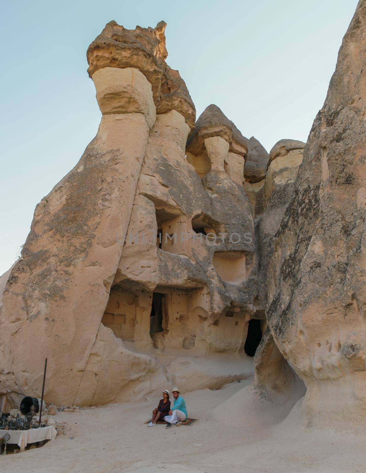 Pasabag Monks Valley happy young couple on vacation in Turkey Cappadocia, Rock Formations in Pasabag Monks Valley, Cappadocia, Turkey.