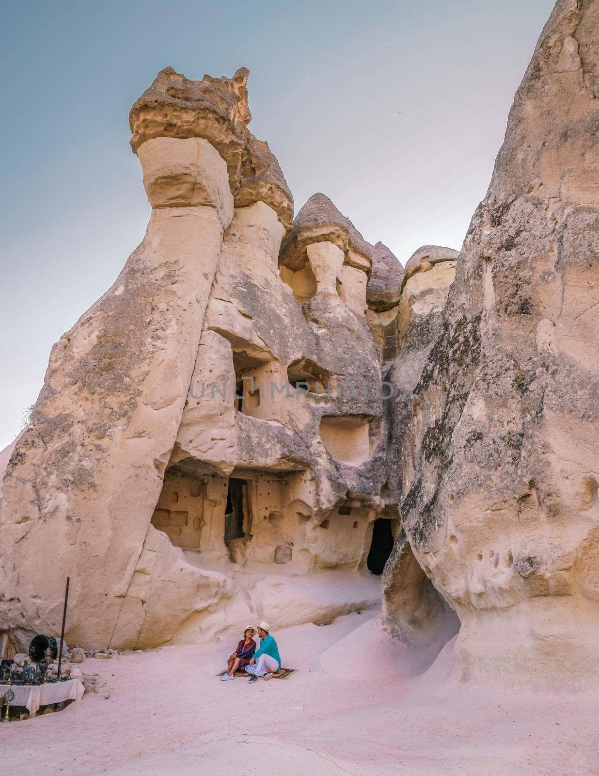 Pasabag Monks Valley happy young couple on vacation in Turkey Cappadocia, Rock Formations in Pasabag Monks Valley, Cappadocia, Turkey.