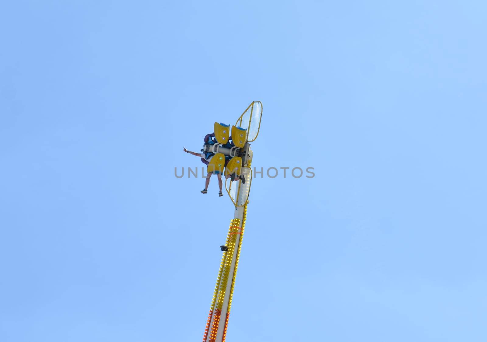 two people in a park on a catapult with a Blue Sky