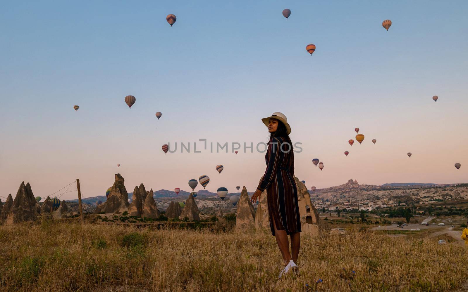 Asian women in hot air balloon during sunrise in Cappadocia Turkey, Kapadokya Goreme by fokkebok