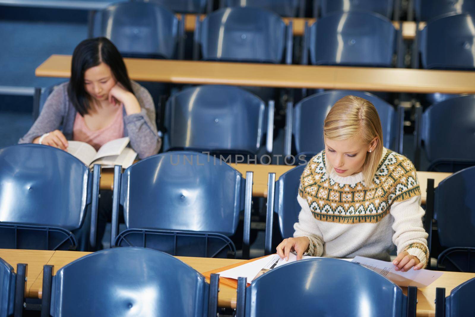 Her education is important to her. A group of students sitting in an exam room