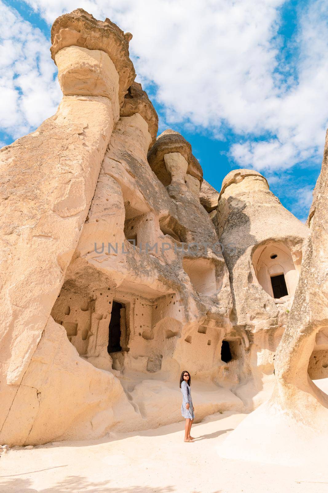 Pasabag Monks Valley happy young women on vacation in Turkey Cappadocia, Rock Formations in Pasabag Monks Valley, Cappadocia, Turkey.