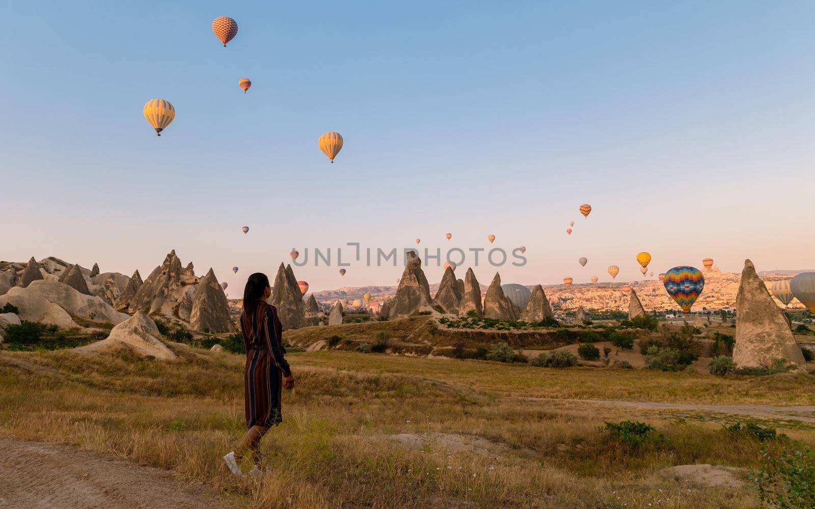 Asian women in hot air balloon during sunrise in Cappadocia Turkey, Kapadokya Goreme by fokkebok