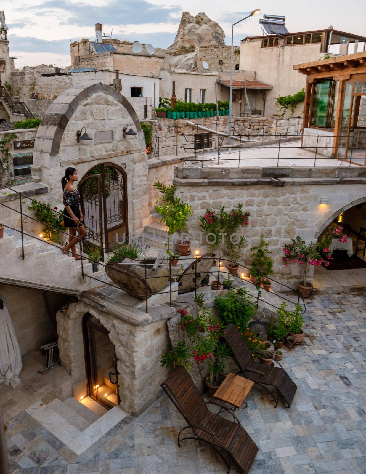 woman in dress at cave house , woman cave house hotel in the mountains of Cappadocia by fokkebok