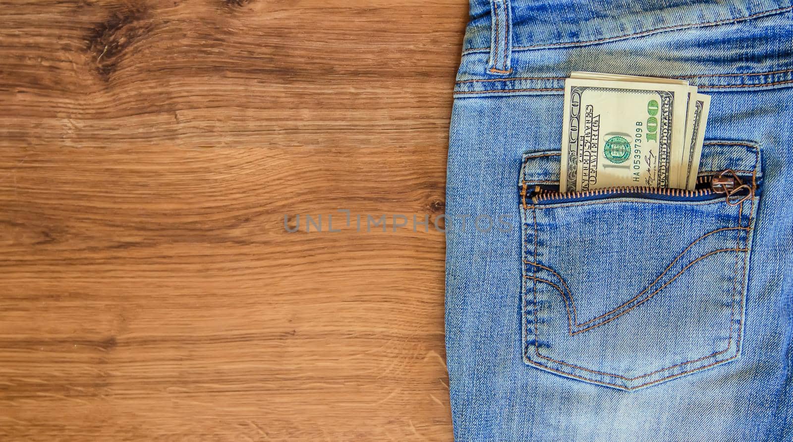 Money in the pocket of jeans. Selective focus.