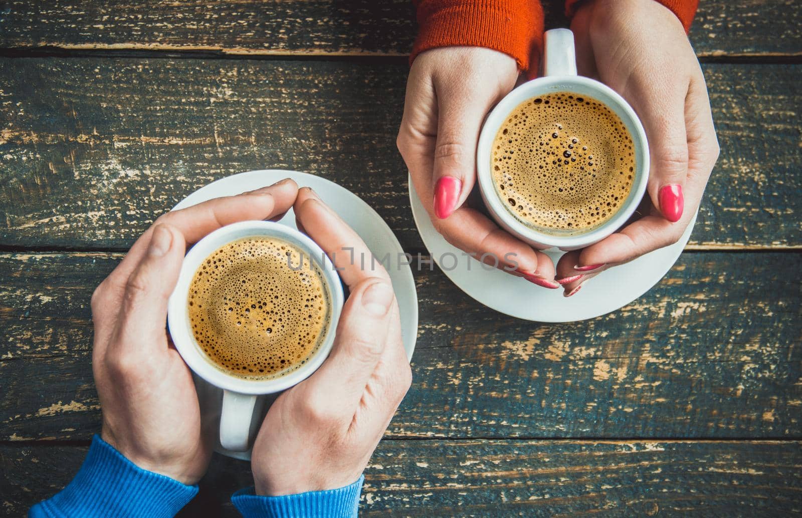 Cup drink for Breakfast in the hands of lovers. Selective focus.