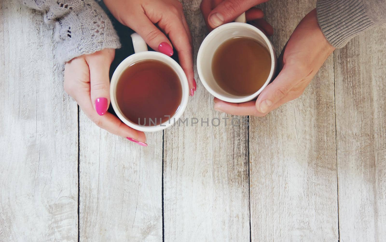 Cup drink for Breakfast in the hands of lovers. Selective focus.
