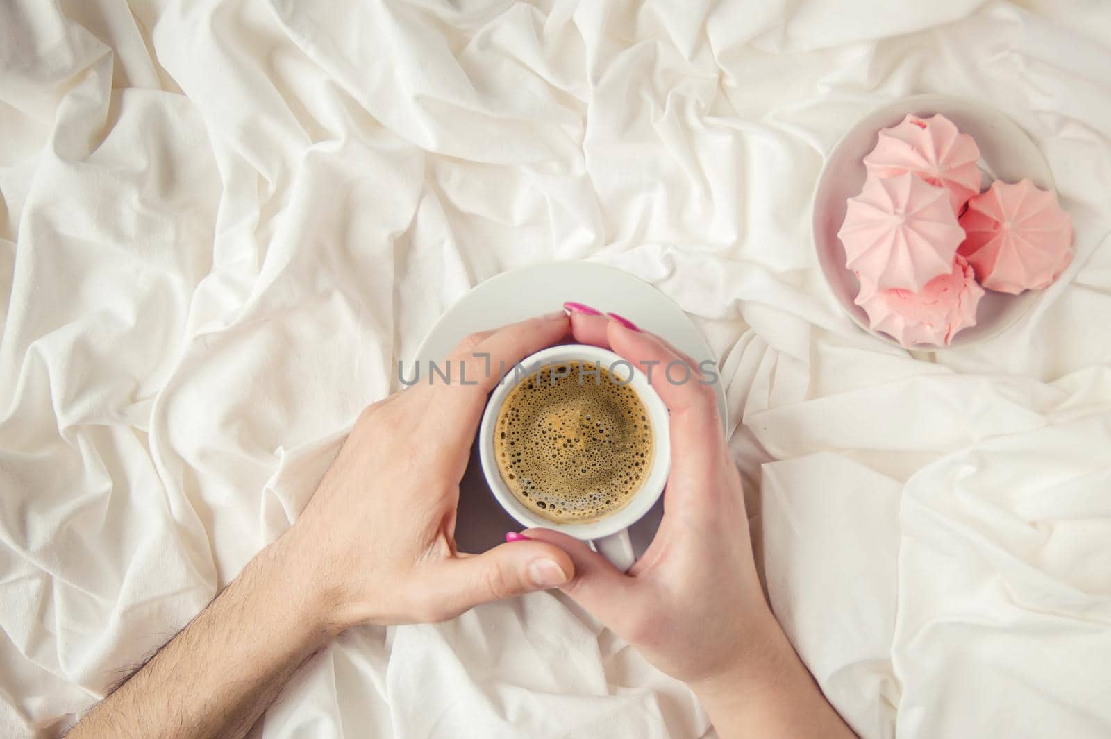 Coffee in bed. Selective focus. Love drink.