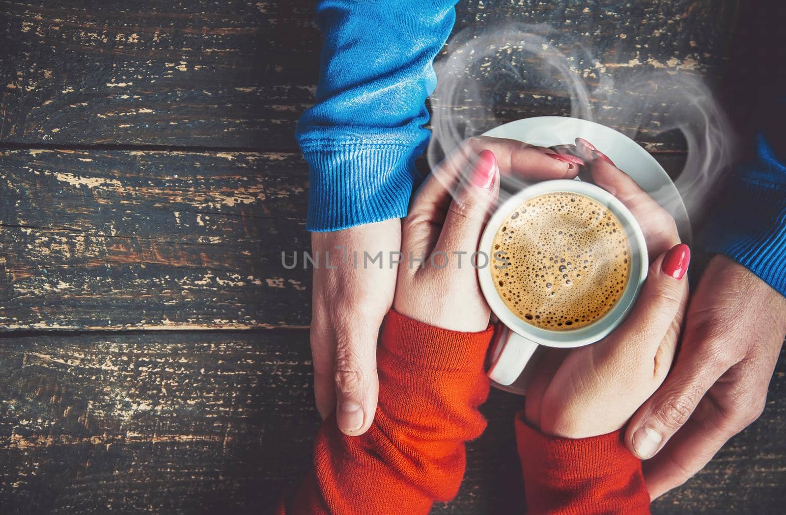 Cup drink for Breakfast in the hands of lovers. Selective focus. cute.