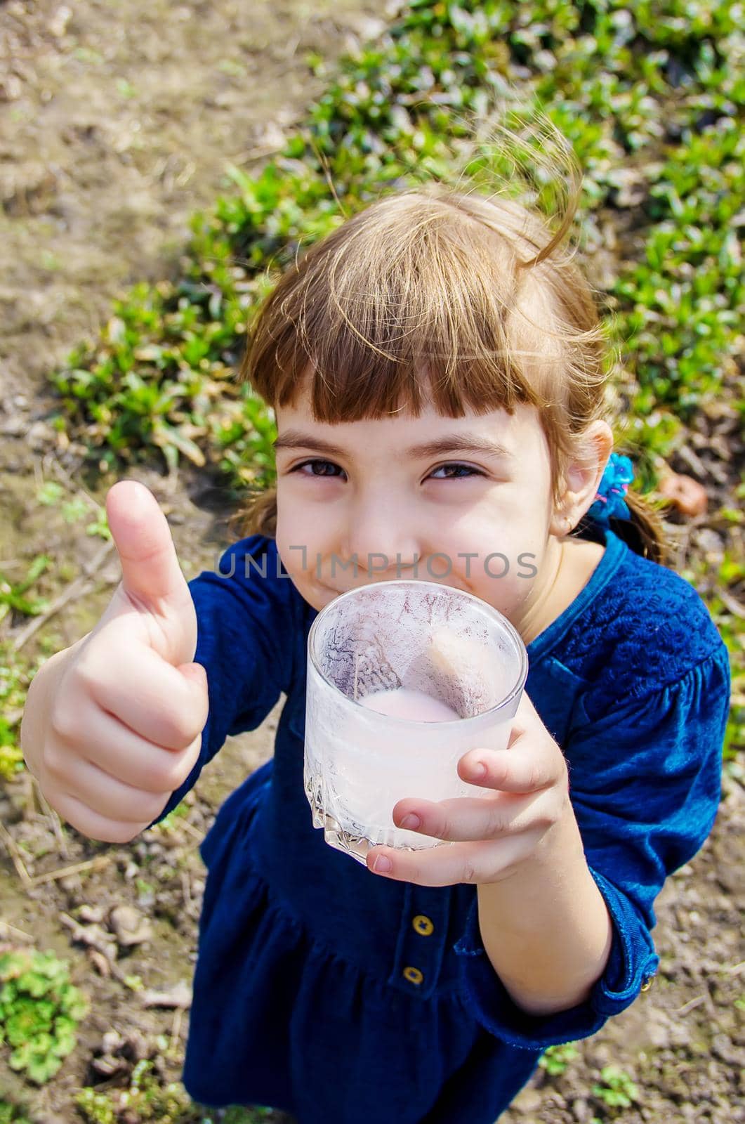 The child drinks milk. Selective focus. Kids.