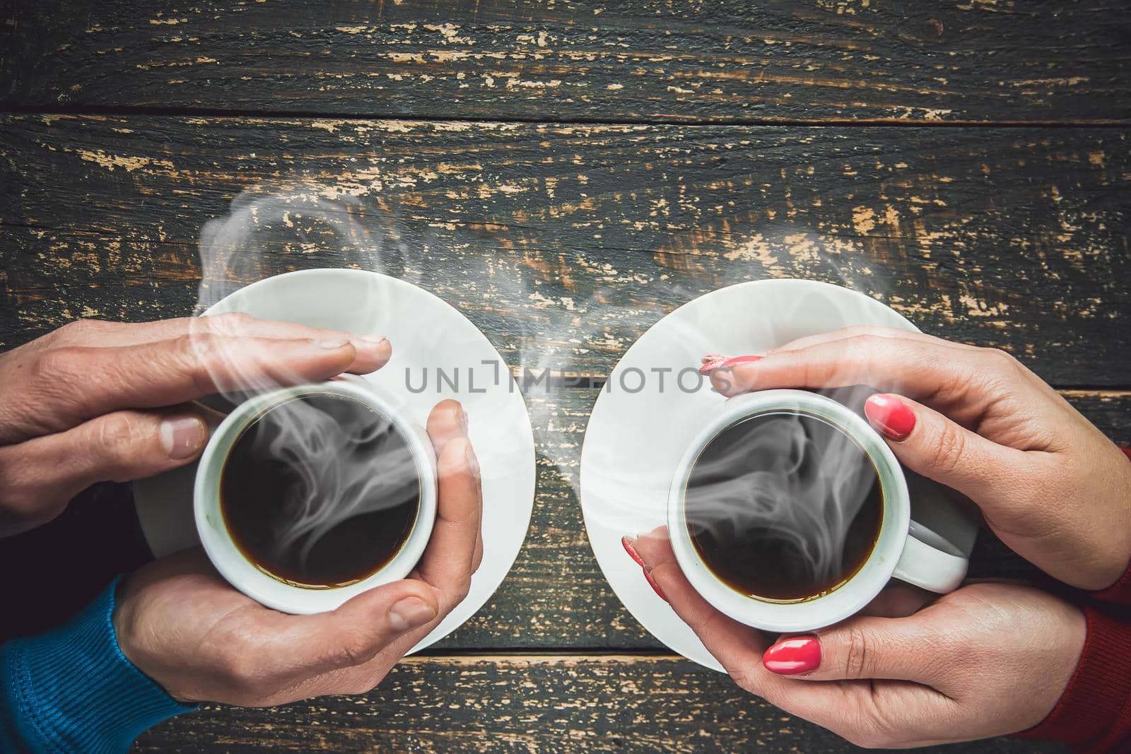 Cup drink for Breakfast in the hands of lovers. Selective focus. cute.