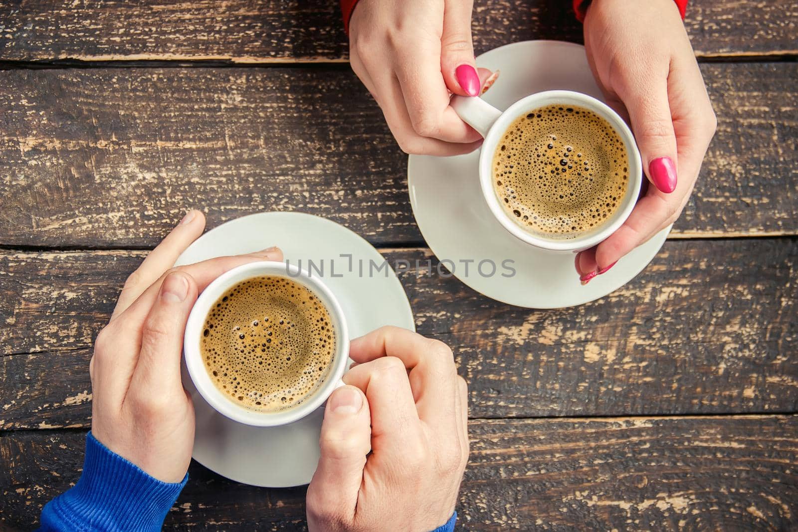 Cup drink for Breakfast in the hands of lovers. Selective focus. by yanadjana