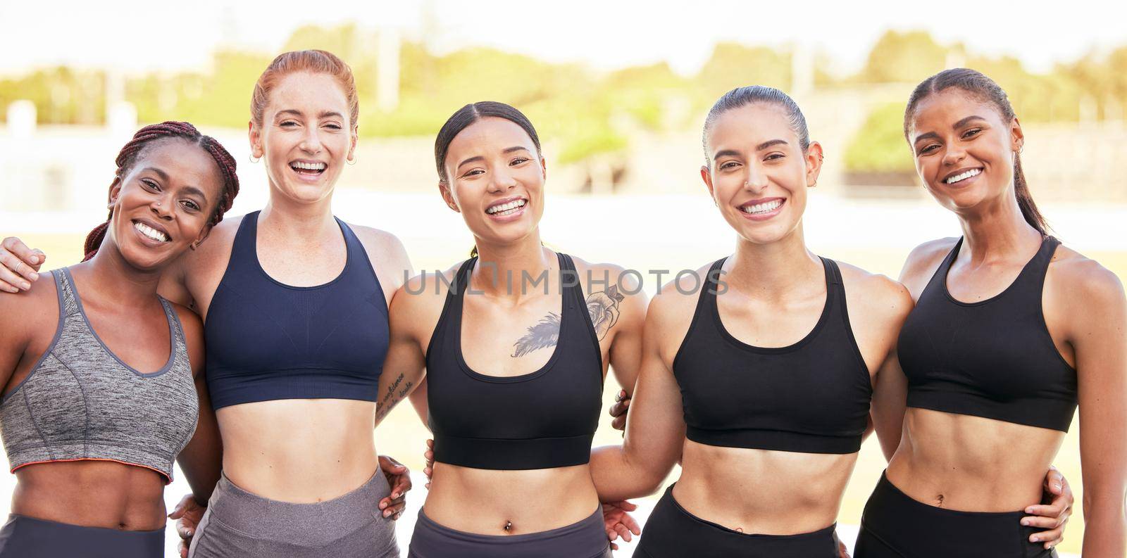 Fitness, portrait and happy running team on a runners racetrack for training, exercise and group workout as friends. Smile, Diversity and healthy girls with of slim, strong and athletic sports body.