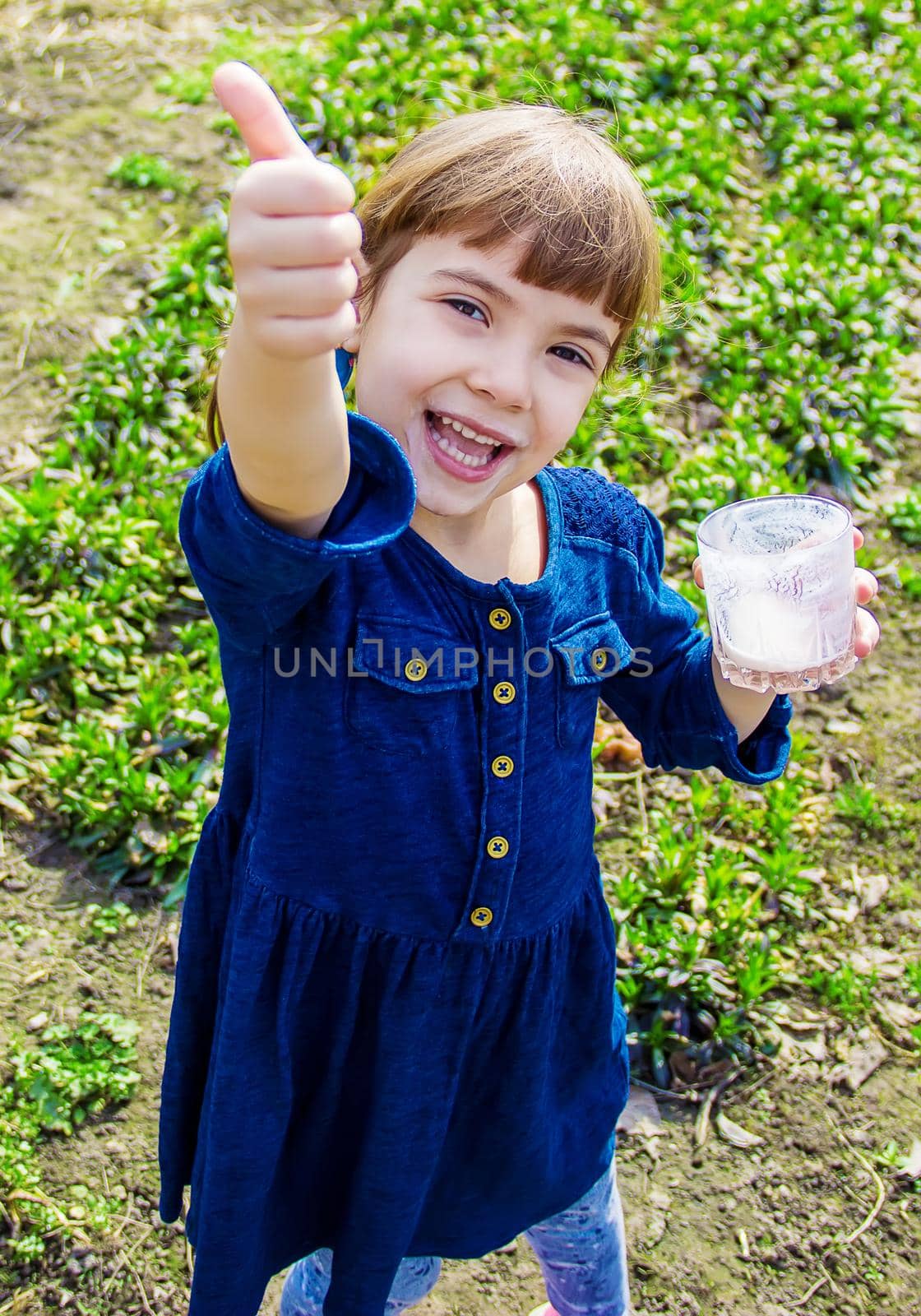The child drinks milk. Selective focus. Kids. by yanadjana