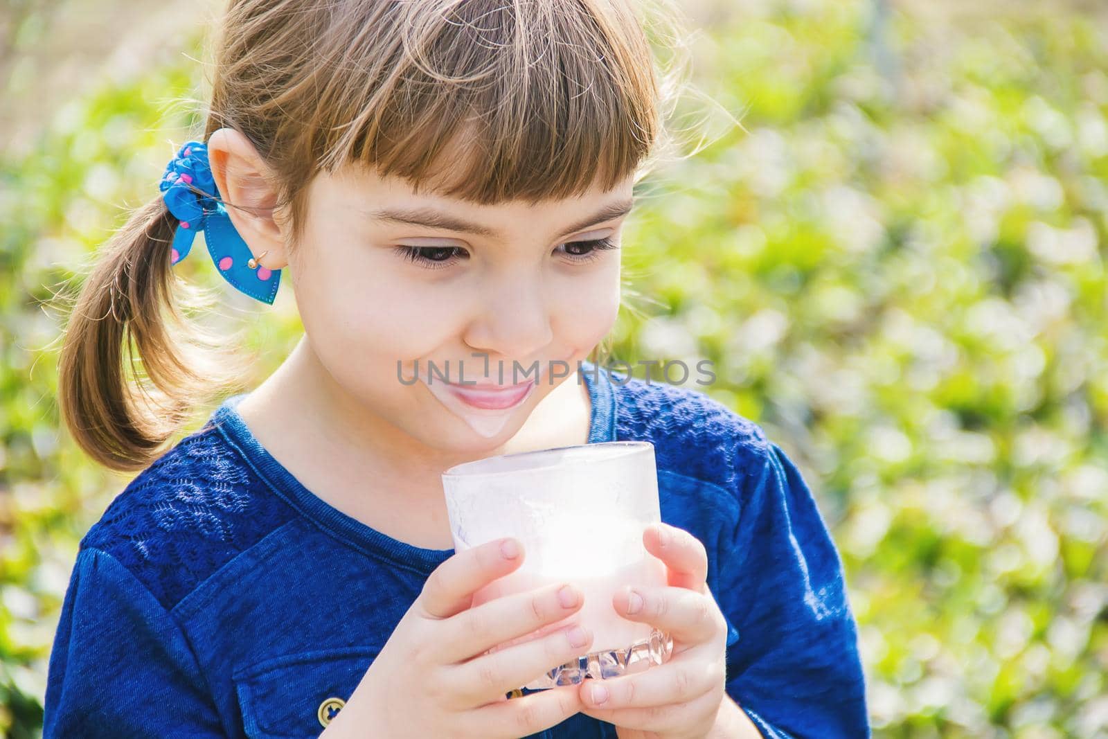 The child drinks milk. Selective focus. Kids. by yanadjana
