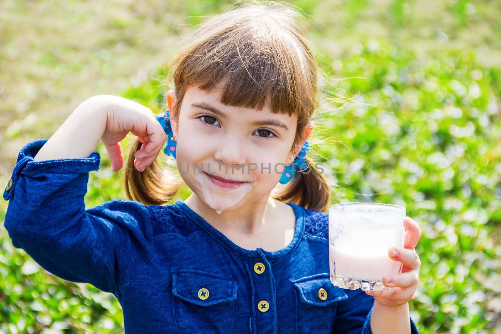 The child drinks milk. Selective focus. Kids.