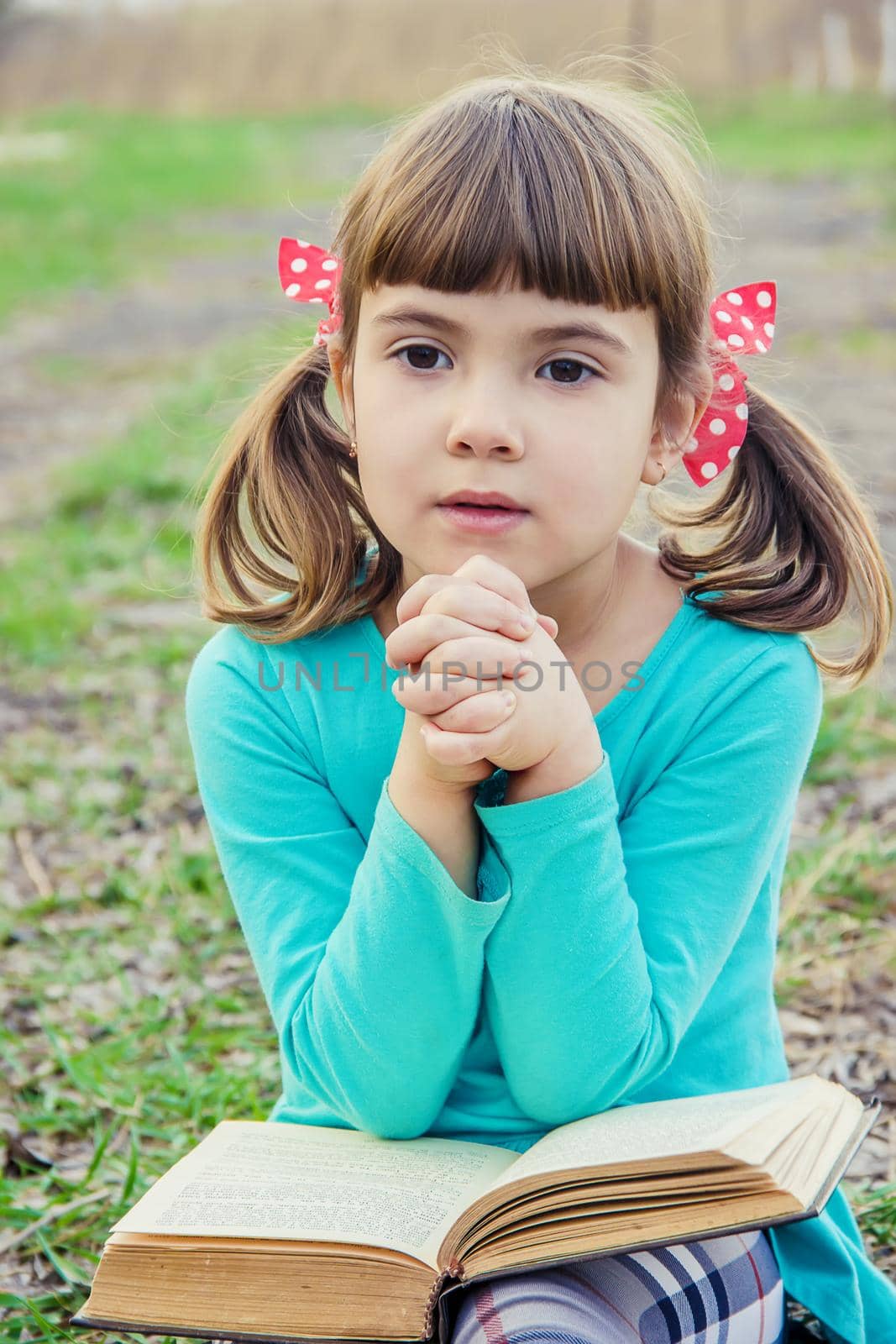 The child prays. Selective focus. People kids. by yanadjana
