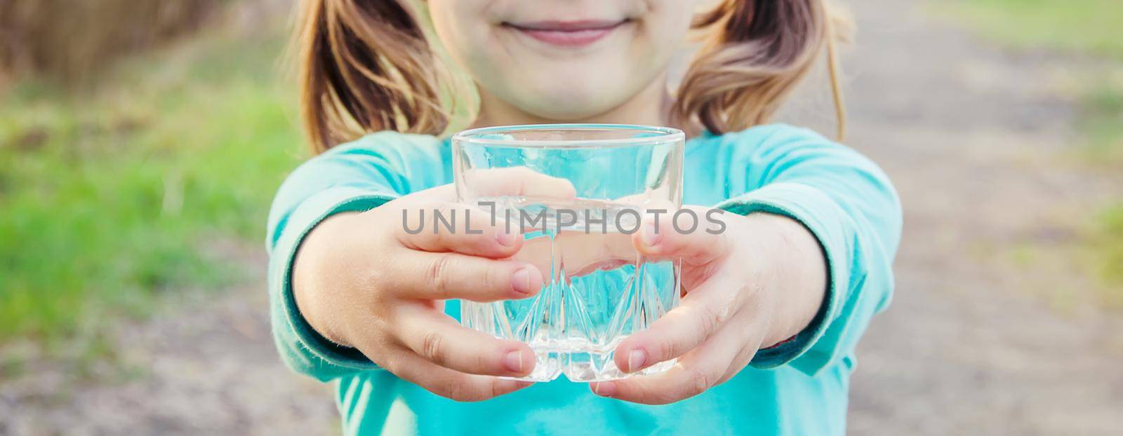 child glass of water. selective focus. Kids.