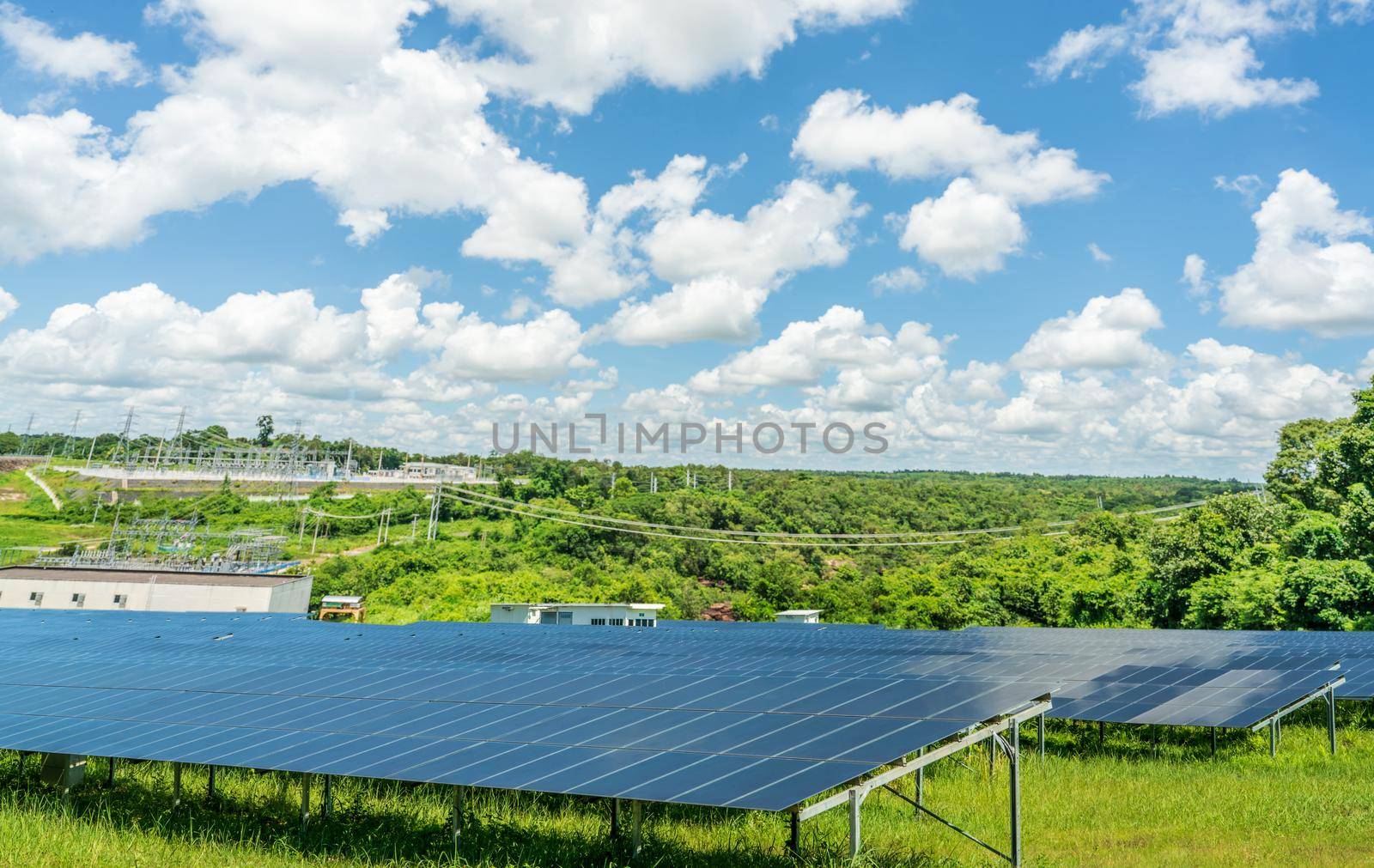 Photovoltaic power station or solar park. PV system. Solar farm and green field. Solar power for green energy. Photovoltaic power plant generate solar energy. Renewable energy. Sustainable resources.