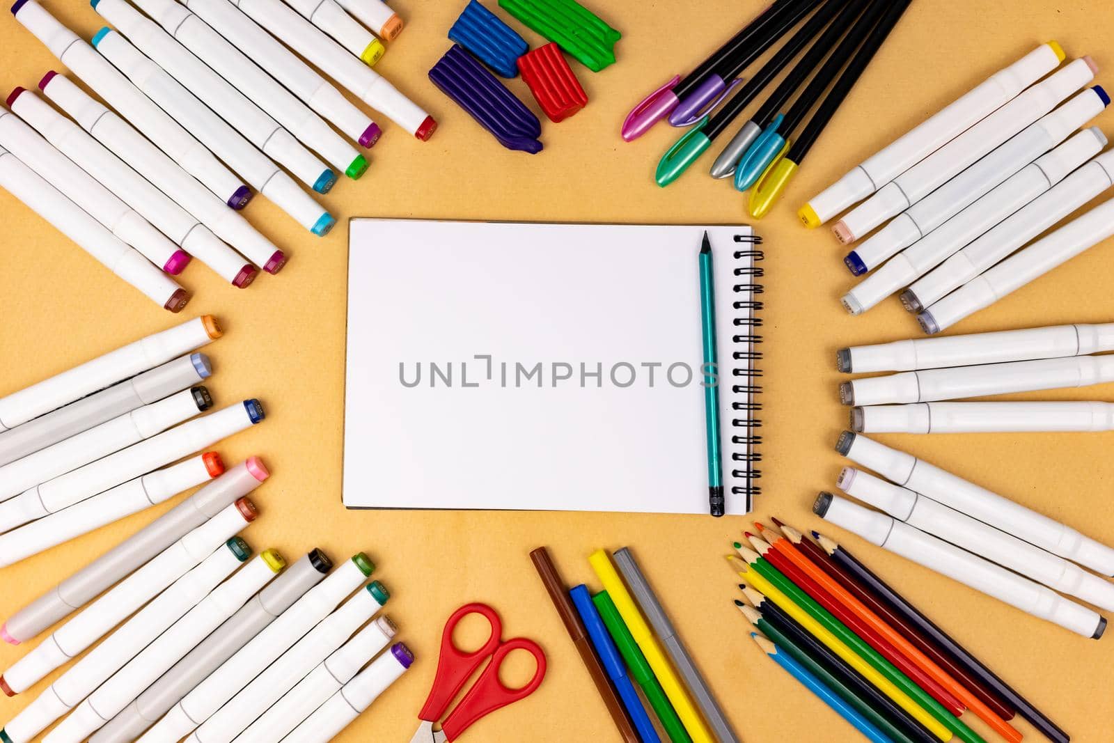 White notebook with a place for inscription on a yellow background.